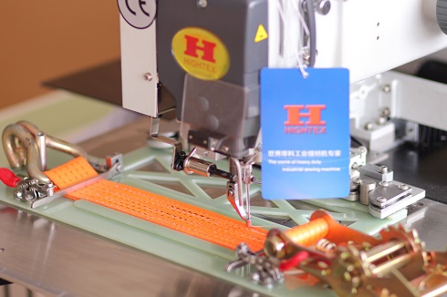 Heavy duty automatic ratchet strap sewing machine